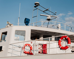 old ship with lifebuoys and good weather