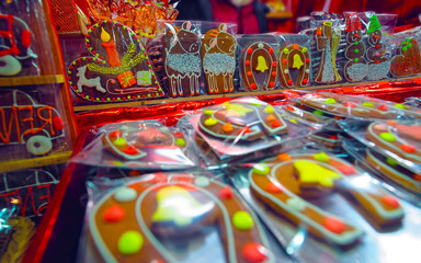 Gingerbread cookies food on Christmas market in Europe in winter. German Night street Xmas and holiday fair in European city or town, December. Riga of Latvia