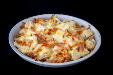 Cheese bakded cauliflower and red lentils spirals