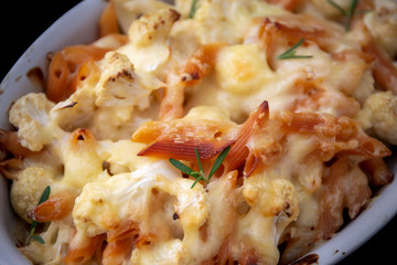 Cheese bakded cauliflower and red lentils spirals