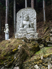 Statue of Fudo Myo-o in the forest near Shosanji, temple 12 of Shikoku pilgrimage - Tokushima prefecture, Japan