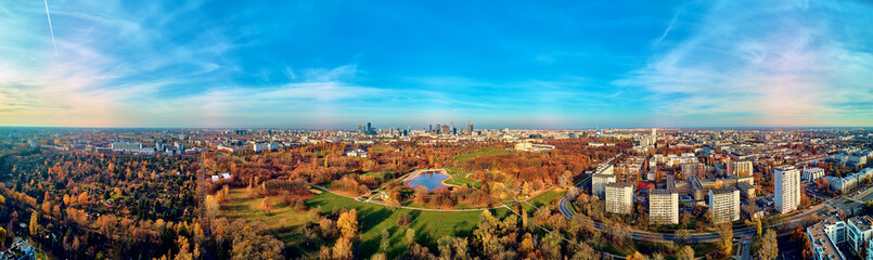 A beautiful panoramic view of the sunset in a fabulous November autumn evening at sunset from drone at Pola Mokotowskie in Warsaw, Poland - Mokotow Field is a large park called 