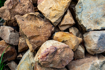 Close-up on piles of stones. Background with big stones
