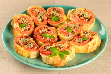 bruschetta with tomato, parmesan, olive oil, ham and oregano
