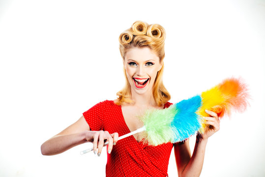 Sexy girl cleaning retro or pinup woman isolated on white. Cleaning lady with a pipidaster in the hands. Everyday life housework.