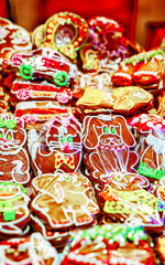 Gingerbread cookies food on Christmas market in Europe in winter. German Night street Xmas and holiday fair in European city or town, December. Riga of Latvia
