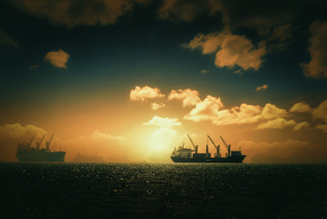 Fototapeta premium Silhouette Logistics and transportation of International Container Cargo ship in the ocean at Sunshine sky, Freight Transportation, Shipping