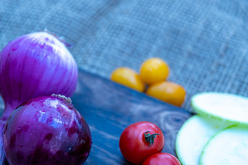 Colored tomatoes, carrots and other rich vegetables for a healthy salad