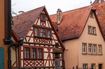 Naklejka premium Warm colored typical German wood framed houses in Rothenburg