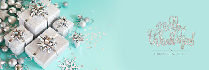 Christmas banner. Xmas silver and glitter gifts box, blue background. Horizontal poster, greeting card, headers, website. Decoration objects flat lay, top view