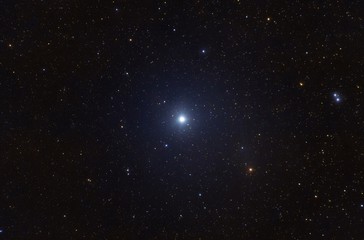 Low angle shot of the shining star Vega in the constellation Lyra looking like a magical fairytale