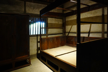 The rustic and simple wooden bed room at village of Chengdu.