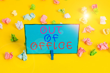 Text sign showing Out Of Office. Business photo showcasing Outside the job Nobody in business Break Leisure Relax time Colored crumpled papers empty reminder white floor background clothespin