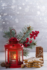 Winter season holidays decorations. Christmas and New Year background with lantern and gingerbread cookies. Room for text