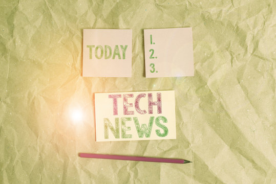 Handwriting text Tech News. Conceptual photo newly received or noteworthy information about technology Papercraft craft paper desk square spiral notebook office study supplies