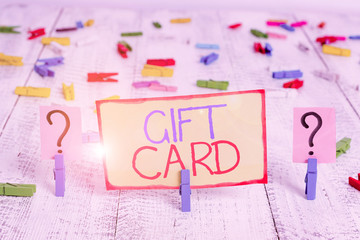 Word writing text Gift Card. Business photo showcasing A present usually made of paper that contains your message Scribbled and crumbling sheet with paper clips placed on the wooden table