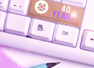 Writing note showing 40 Years. Business concept for Remembering or honoring special day for being 40 years in existence