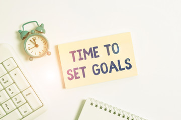 Conceptual hand writing showing Time To Set Goals. Concept meaning Desired Objective Wanted to accomplish in the future Keyboard with empty note paper and pencil white background