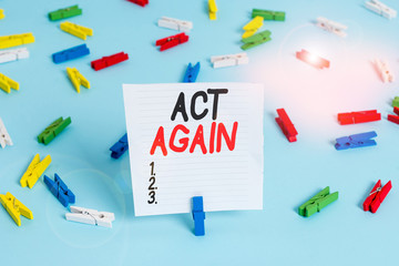 Word writing text Act Again. Business photo showcasing do something for a particular purpose Take action on something Colored clothespin papers empty reminder blue floor background office pin