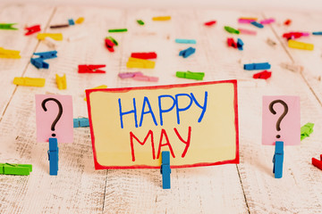 Word writing text Happy May. Business photo showcasing Happy new month Best wishes Fresh Start Celebrating Holiday Scribbled and crumbling sheet with paper clips placed on the wooden table