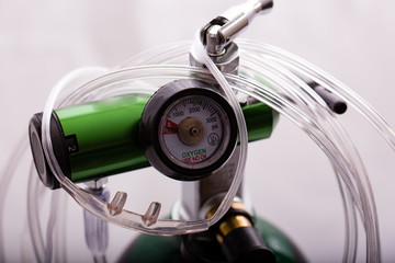 Close-up of a oxygen cylinder regulator and cannula