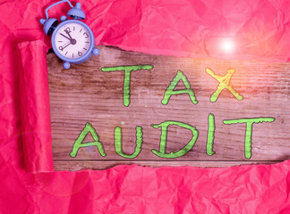 Writing note showing Tax Audit. Business concept for examination or verification of a business or...