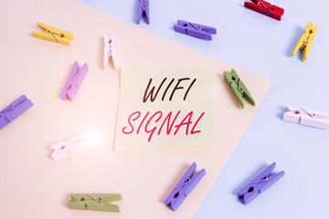 Word writing text Wifi Signal. Business photo showcasing provide wireless highspeed Internet and network connections Colored clothespin paper empty reminder yellow blue floor background office
