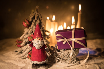 Candles in night in christmas mood on vintage wooden boards
