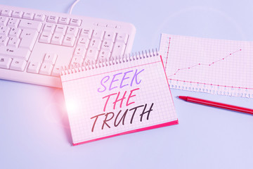 Text sign showing Seek The Truth. Business photo showcasing Looking for the real facts Investigate study discover Paper blue desk computer keyboard office study notebook chart numbers memo