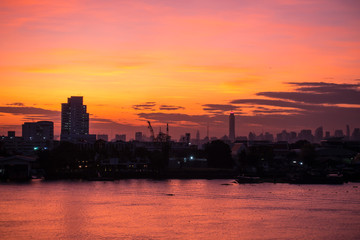 Aerial view of Bangkok Skyline along Chaophraya River sunset twilight