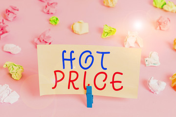 Word writing text Hot Price. Business photo showcasing Buyer or seller can obtain something for a product sold or buy Colored crumpled papers empty reminder pink floor background clothespin