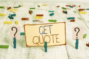 Word writing text Get Quote. Business photo showcasing the most recent price to which a buyer and seller agreed Scribbled and crumbling sheet with paper clips placed on the wooden table