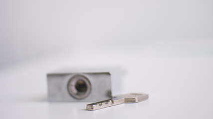 Lock and key on white tone.