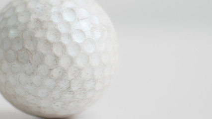 Old golf ball on white tone.
