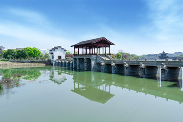 Fototapeta na wymiar Village and road Bridge along the xin 'an river in anhui, China