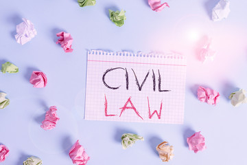 Fototapeta na wymiar Word writing text Civil Law. Business photo showcasing Law concerned with private relations between members of community Colored crumpled rectangle shaped reminder paper light blue background