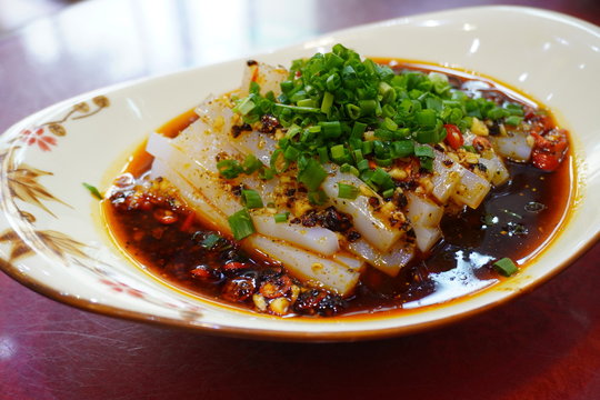 Liang Fen, literally meaning “cold powder”, is a noodle made of bean starch jelly slathered in a delicious savory, tangy, and spicy sauce, filled with chili oil and garlic