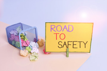 Writing note showing Road To Safety. Business concept for Secure travel protect yourself and others Warning Caution Trash bin crumpled paper clothespin reminder office supplies