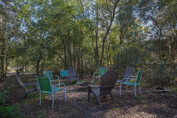 Fototapeta premium Fire pit surrounded by trees in the shade