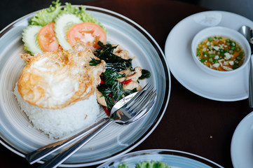 Basil chicken with fried egg and chilli with fish sauce