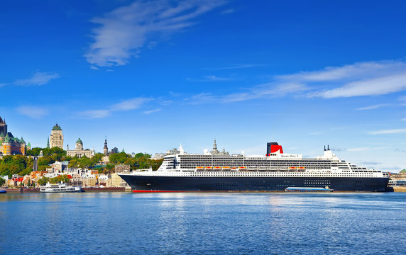 QUEBEC CITY, CANADA - SEPTEMBER 09, 2019: RMS Queen Mary 2 is the largest ocean liner ever built, having served as the flagship of the Cunard Line docked at port Quebec City