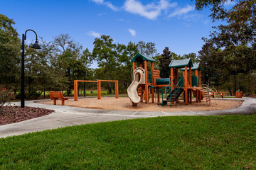 Wooden playground with a slide and swingset