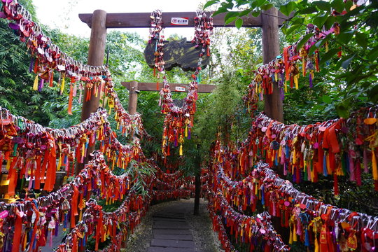 Wishes tree on market place full of tourists on Jinli ancient street in Chengdu city downtown in Sichuan. Translation is "Let all wishes will be executed truly".