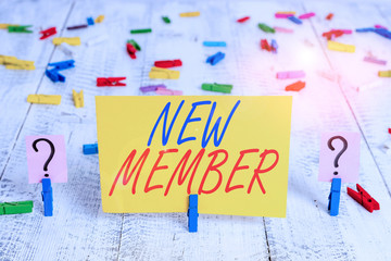 Writing note showing New Member. Business concept for recruiting employee to company or team Birth of fresh child Crumbling sheet with paper clips placed on the wooden table