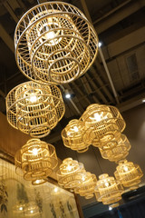 Beautiful lamp formed by a rattan. Rattan is a type of material that is used in wicker weaves. Rattan is a naturally growing vine like species that is native to tropical regions like Asia and Africa