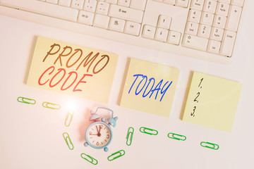 Handwriting text Promo Code. Conceptual photo digital numbers that give you good discount on certain product Empty orange square papers and clock by the pc keyboard with copy space
