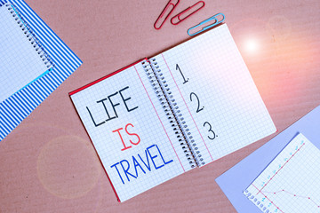 Conceptual hand writing showing Life Is Travel. Concept meaning Exposure to the diversity Tourism Promoting Landmarks Striped paperboard cardboard office study supplies chart