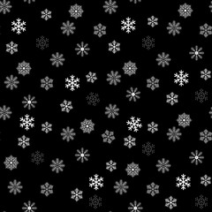 Seamless pattern of snowflakes on a black background