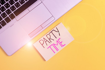 Fototapeta premium Word writing text Party Time. Business photo showcasing the right moment to celebrate and have fun in social event Slim trendy silver open laptop square sticky notepad colored background