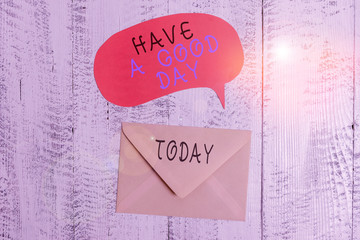 Handwriting text writing Have A Good Day. Conceptual photo Nice gesture positive wishes Greeting Enjoy Be happy Front view closed envelop speech bubble lying wooden vintage background
